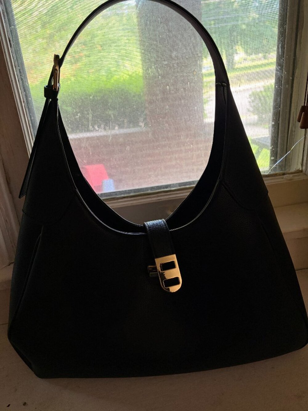 Black purse with buckle from H&M /  Triangular shoulder bag